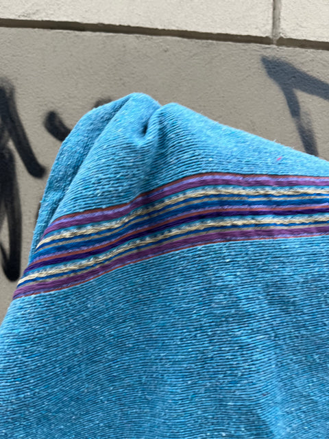 A Pretty Blue Pom Pom Throw Blanket