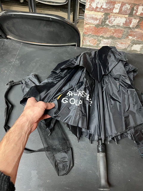 A Serious Black Umbrella With Sleeve