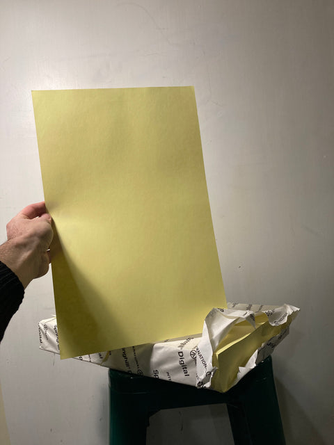 Stack of Yellow 11x17 inches Paper