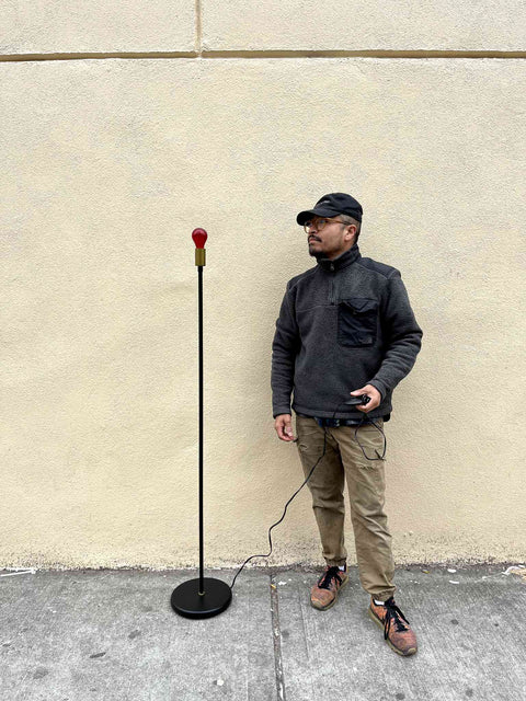Minimalist Floor Lamp With Red Light Bulb