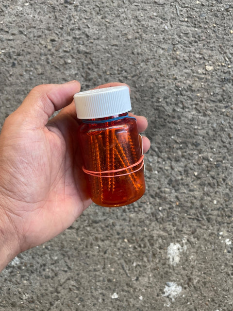 Orange Bottle Full Of Screws