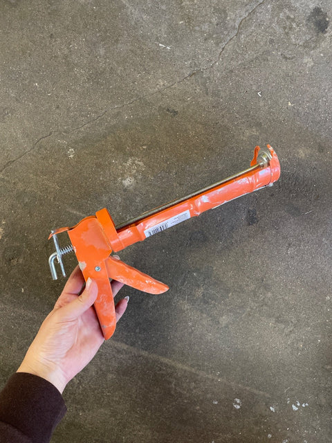Orange Caulking Gun