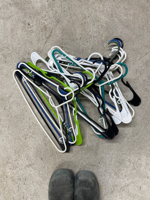 Pile Of Colorful Clothes Hangers