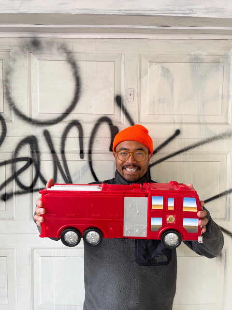 Red Fire Truck Toy That Turns Into A Fire Dept When You Open It