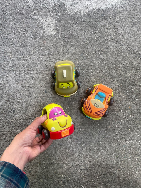 Three Smiling Toy Cars