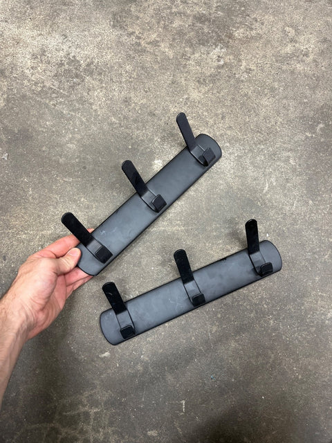 Two Sleek Black Wall Hooks