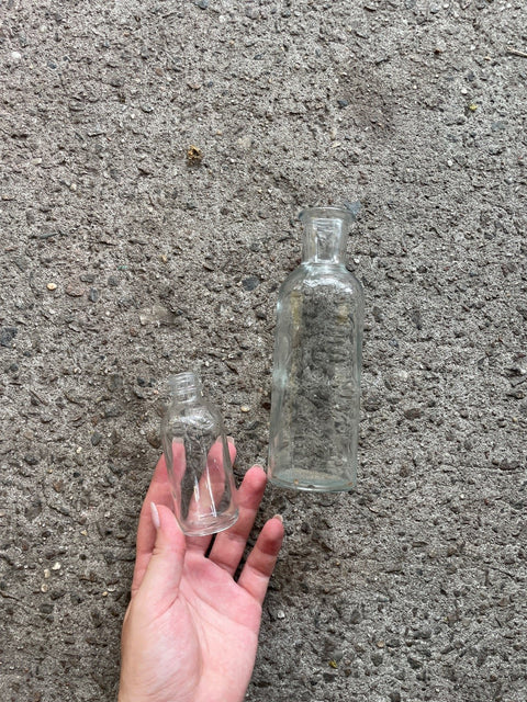 Two Smooth Clear Glass Bottles