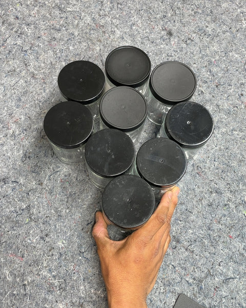 Set of Eight Glass Jars with Black Lids
