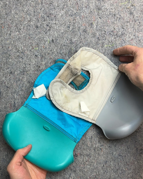 Two OXO Tot Roll-Up Bibs
