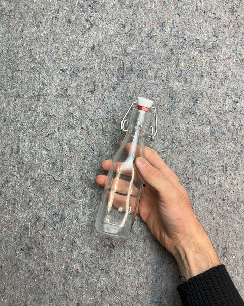 Clear Glass Bottle with Swing Top Lid