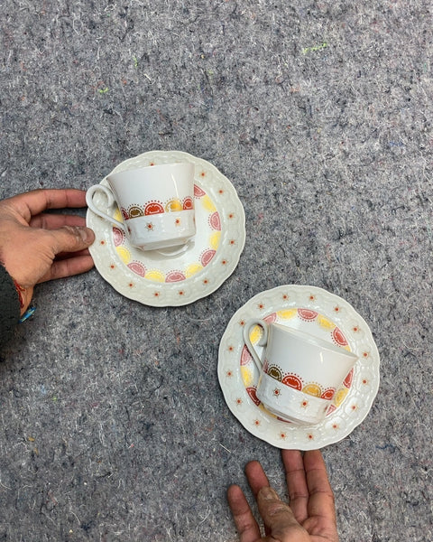 Two Decorative Tea Cups and Saucers