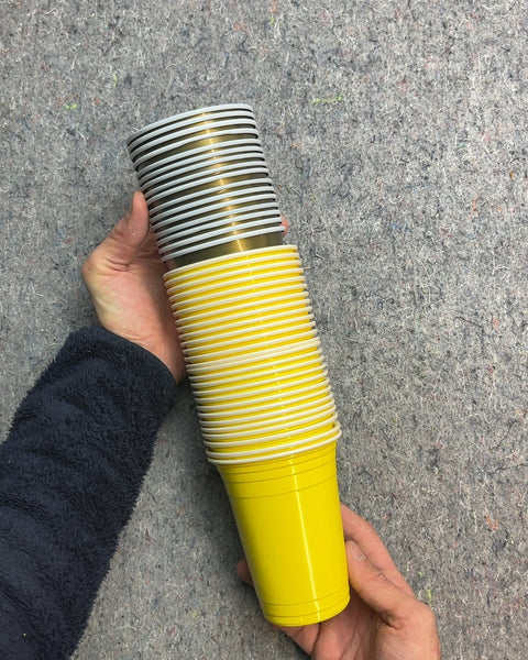 Stack of Yellow and Gray Plastic Cups