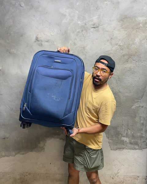 Bigass, flawed Samsonite Blue Rolling Suitcase for Monica G