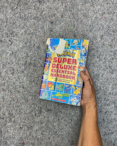 Pokemon Super Deluxe Essential Handbook by Scholastic