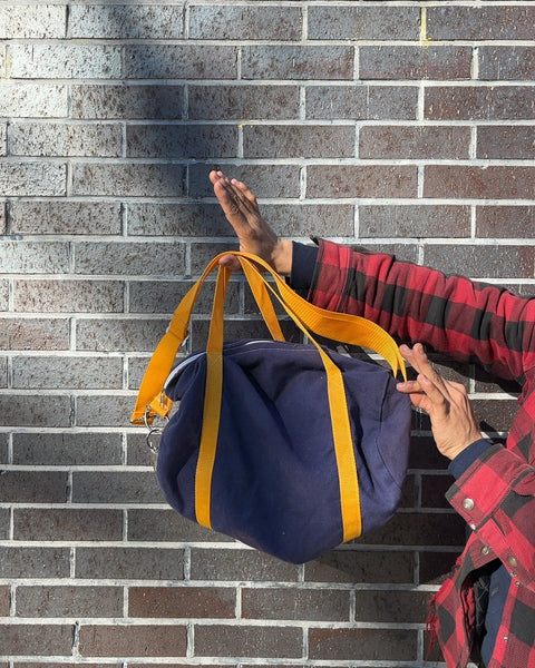 Small Blue Duffel Bag with Yellow Straps