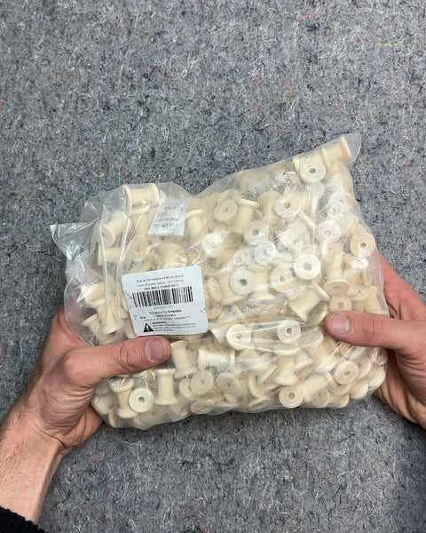 A Whole Bag Of Wood Spools For Crafting