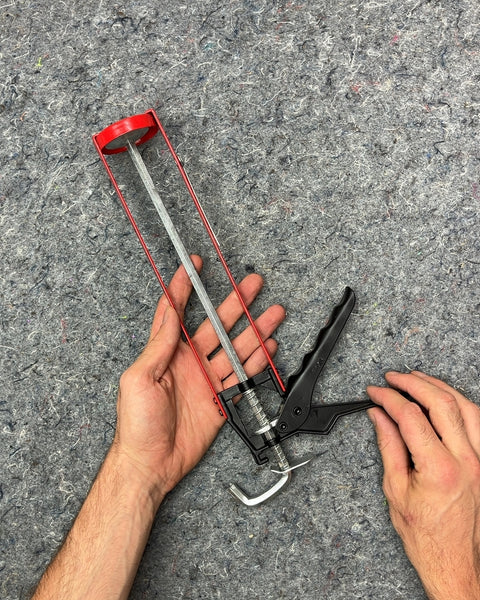 Red and Black Caulk Gun