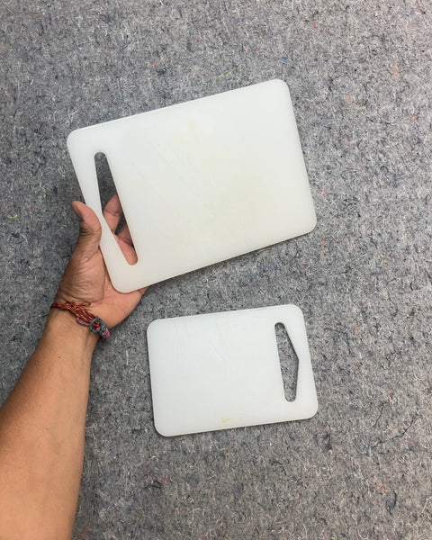 Two White Plastic Cutting Boards