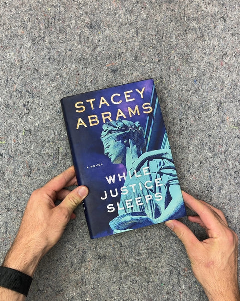 While Justice Sleeps by Stacey Abrams