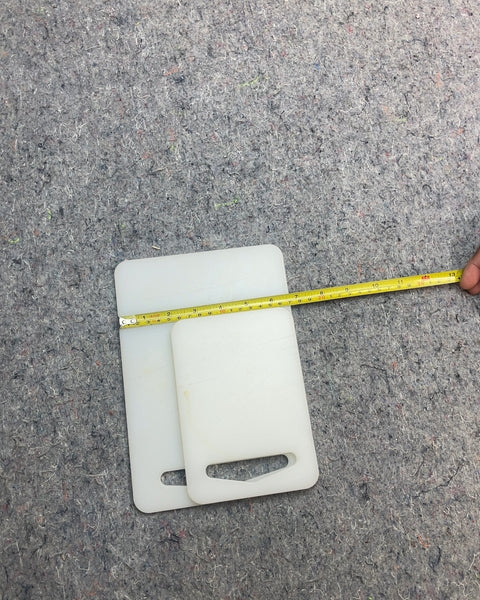 Two White Plastic Cutting Boards