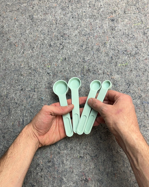 Set of Four Green Measuring Spoons That Clips Together Nicely