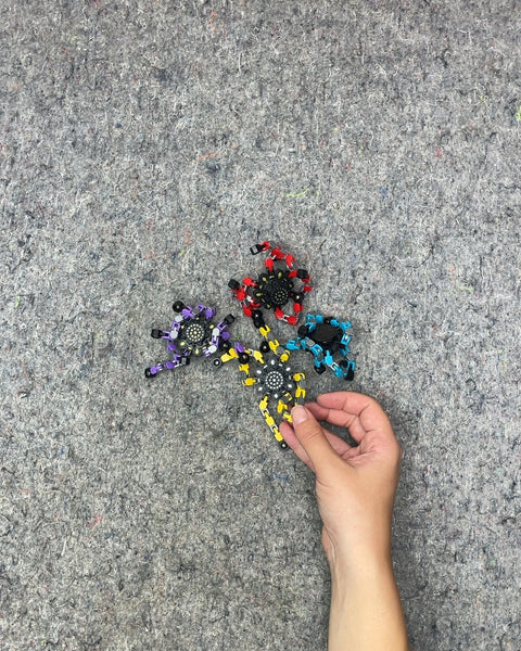 Four Colorful Tiny Mechanoid Looking Toys with Flexible Legs To Stand Up or Make Cool Shapes With