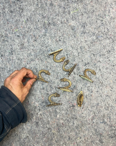 Seven Decorative Metal Hooks