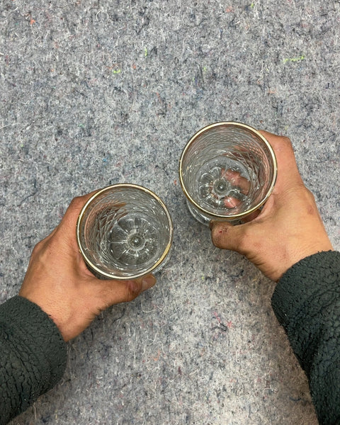 Two Embossed Glass Goblets with Gold Trim