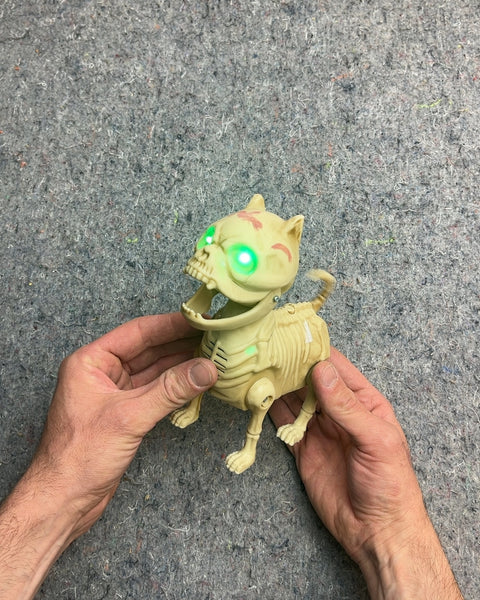 Animated Skeleton Dog With Light-up Green Eyes