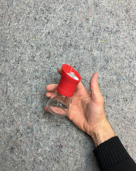 Red and Clear Glass Spice Grinder