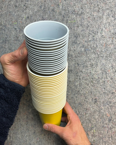 Stack of Yellow and Gray Plastic Cups