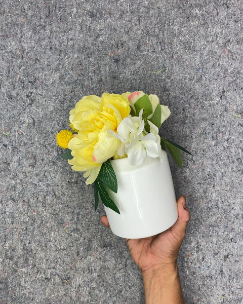 White Ceramic Vase with Yellow and White Faux Flowers