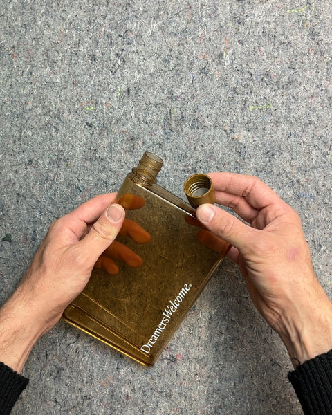 Brown Flat Water Bottle with "Dreamers Welcome"