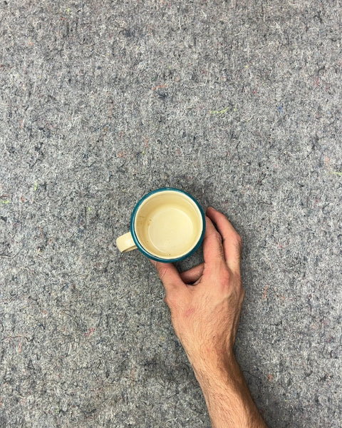 Small Faded Enamel Mug with Blue Rim