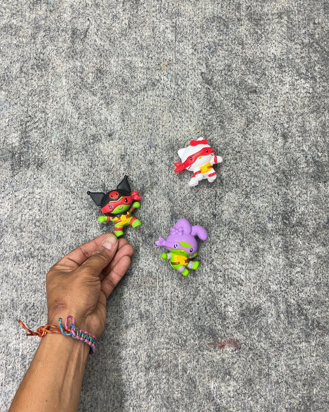 Hello Kitty and Ninja Turtle Figurines