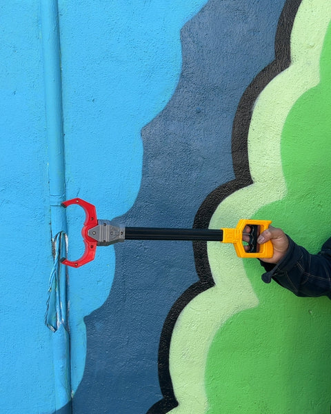 Black and Yellow Grabber Tool For Your Toddler To Be Able To Grab Even More Things Off The Shelves