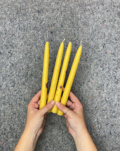 Four Yellow Taper Candles
