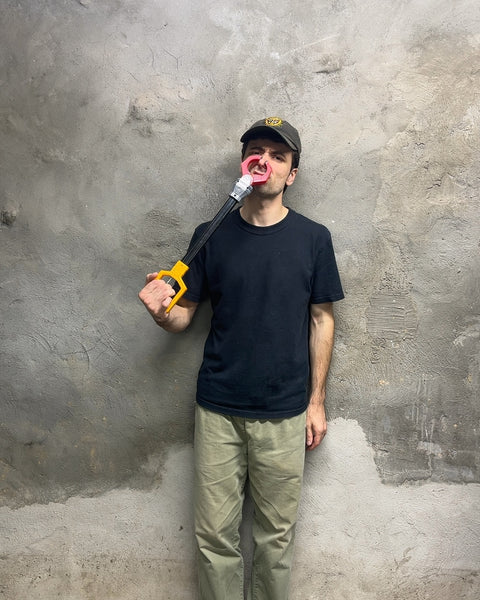 Yellow and Black Grabber Tool with Pink Claw