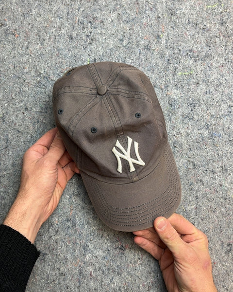 A New York Yankees Baseball Cap So Used It Has A Charm To It