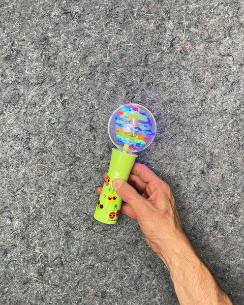 Green Light-Up Spinning Toy Wand