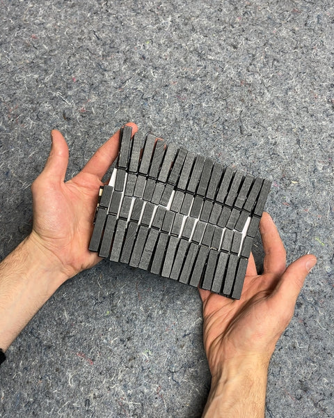 A Bunch Of Black Wooden Clothespins