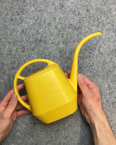 Small Yellow Plastic Watering Can with Leaf Design