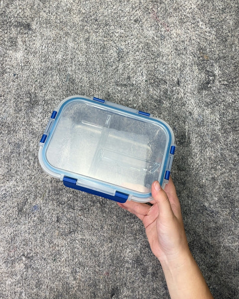 A Third Clear Plastic Lunch Box with Blue Clasps